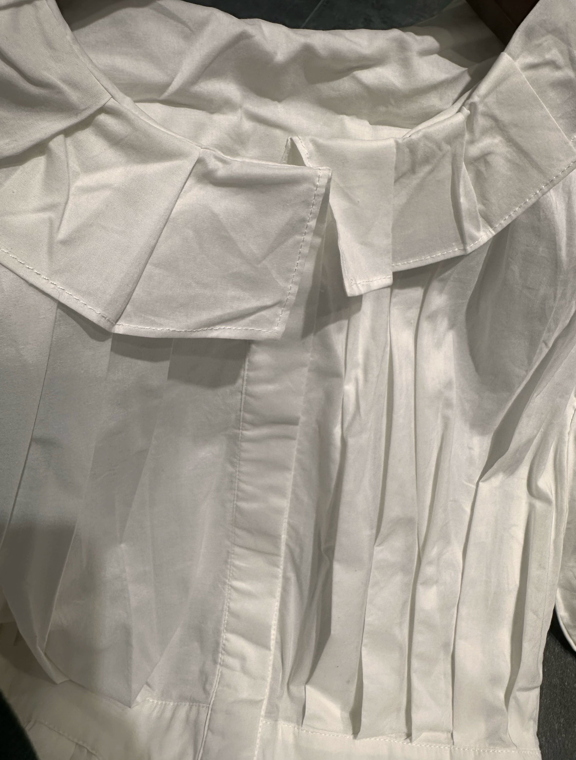 white midi dress with a crew neck and pleated lantern sleeves