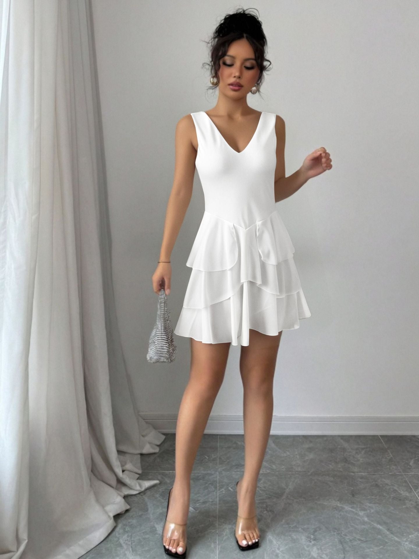 white V-neck low-cut halter top with ruffled hem mini dress