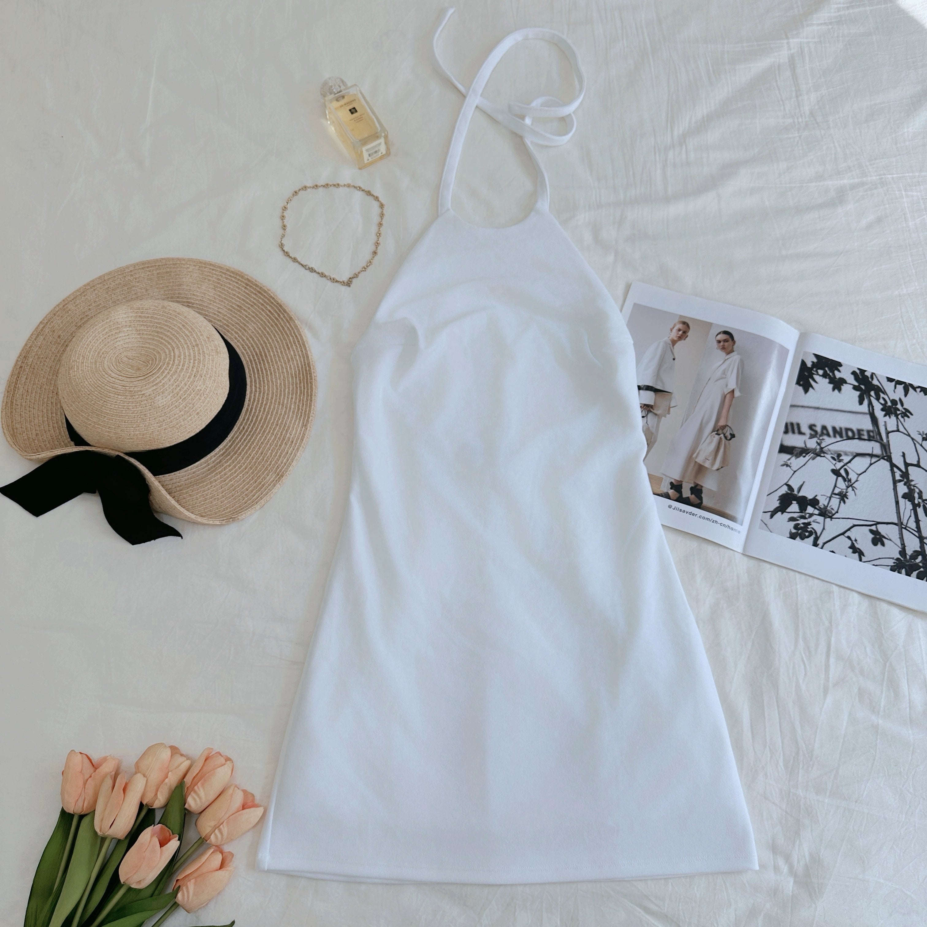 white halterneck open back A-line dress