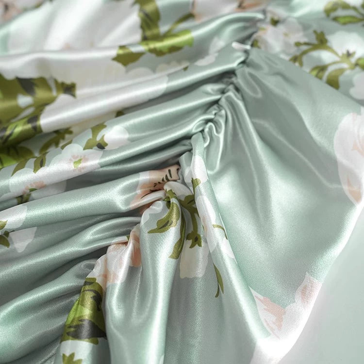 green satin print resort dress