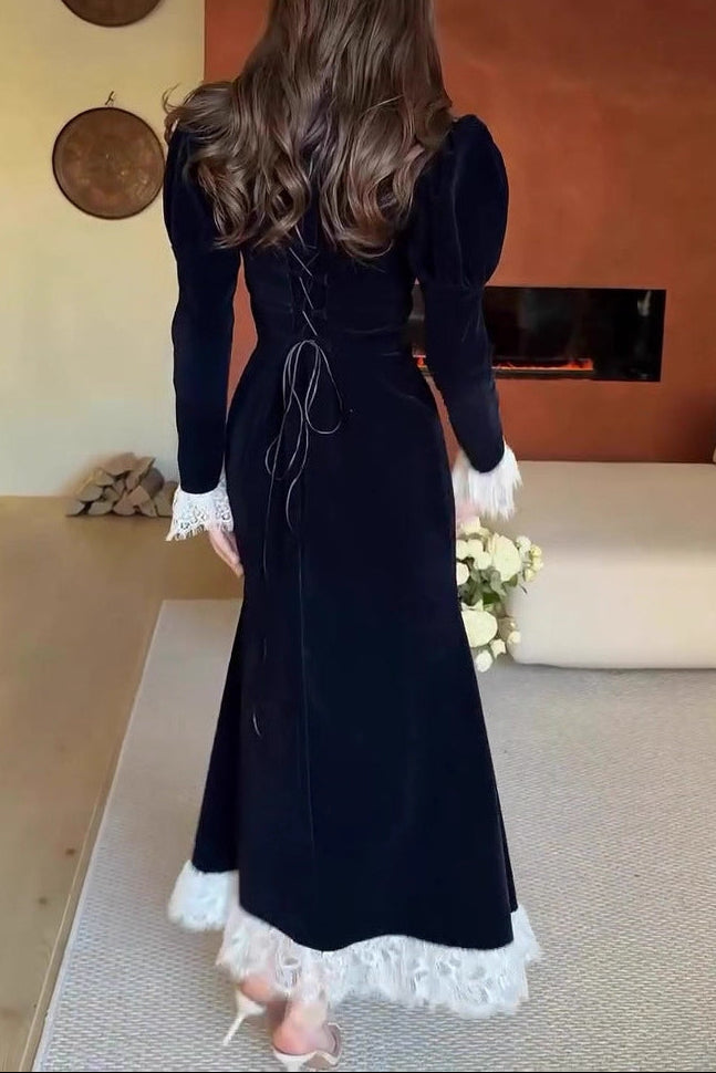 black long-sleeved waist-cinching dress