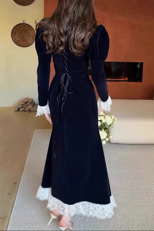 black long-sleeved waist-cinching dress