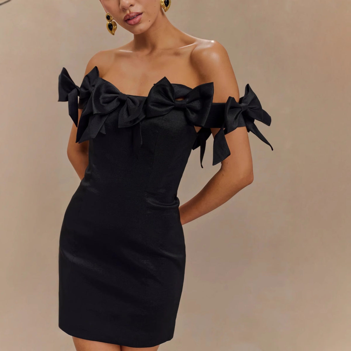 eileen Off-shoulder backless bow mini dress in black