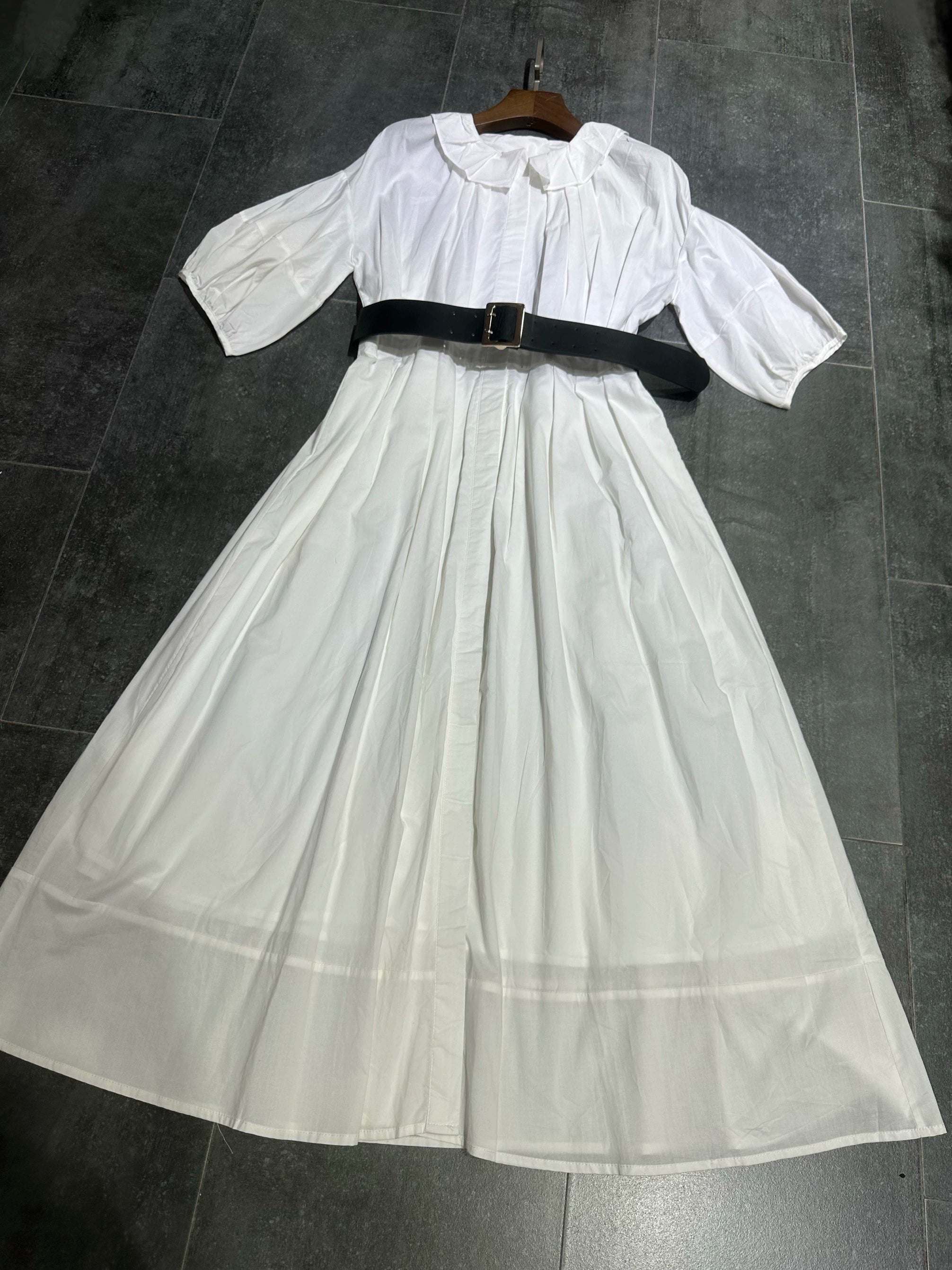 white midi dress with a crew neck and pleated lantern sleeves