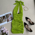 green pleated halterneck mini dress