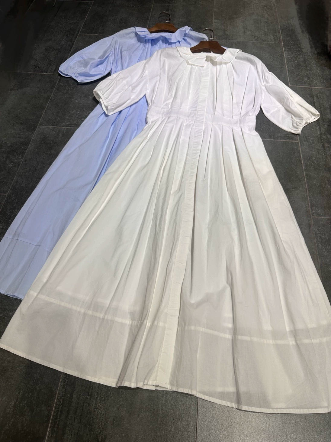 white midi dress with a crew neck and pleated lantern sleeves